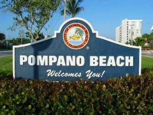 Welcome sign for Pompano Beach promoting Hercules we buy junk cars Pompano Beach services