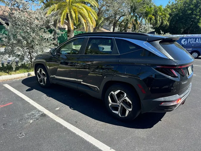 A black SUV parked outdoors handled by Hercules, a junk car buyer in Broward County.